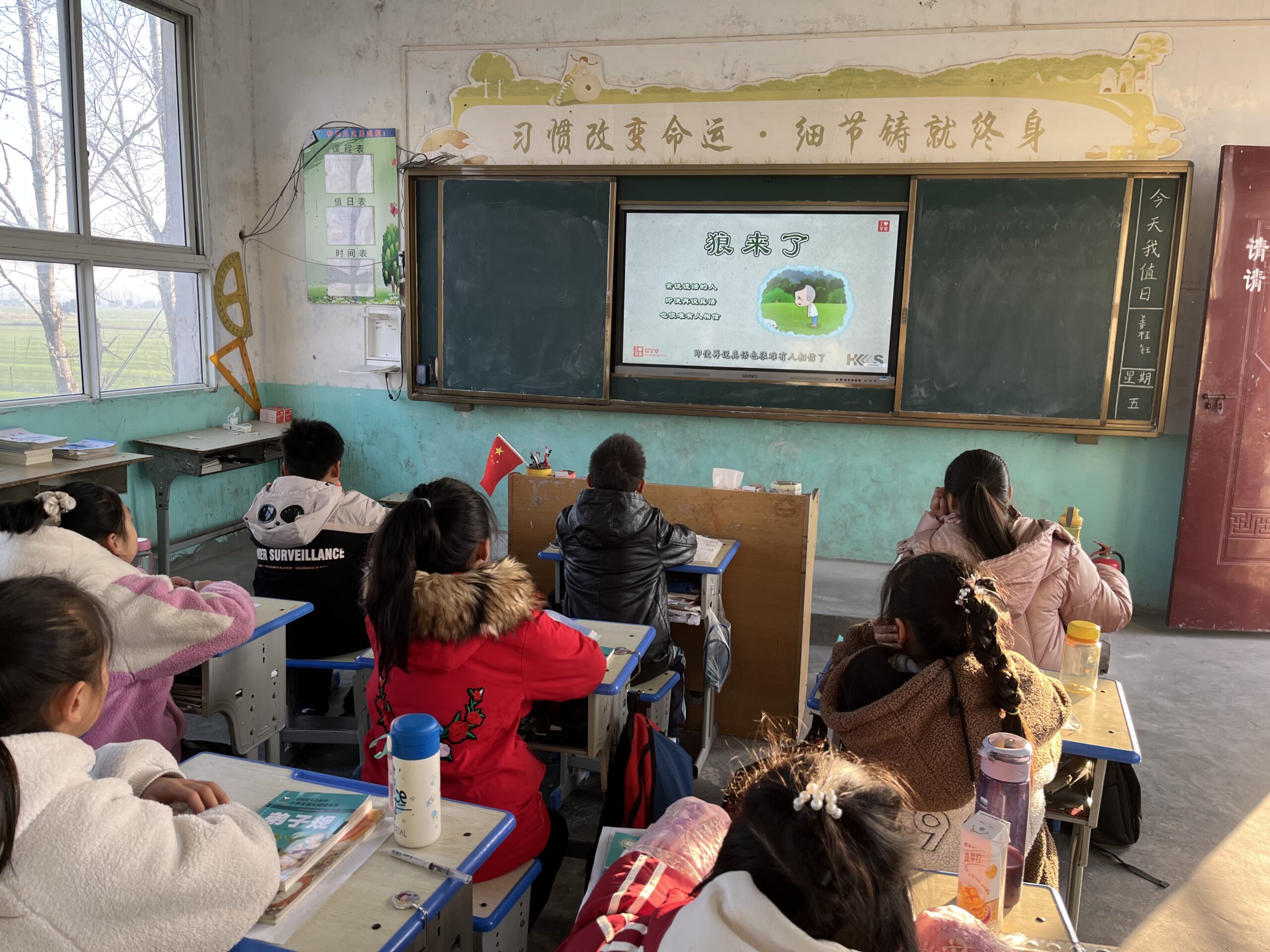 Students in the moral education class listened to the lecture attentively.